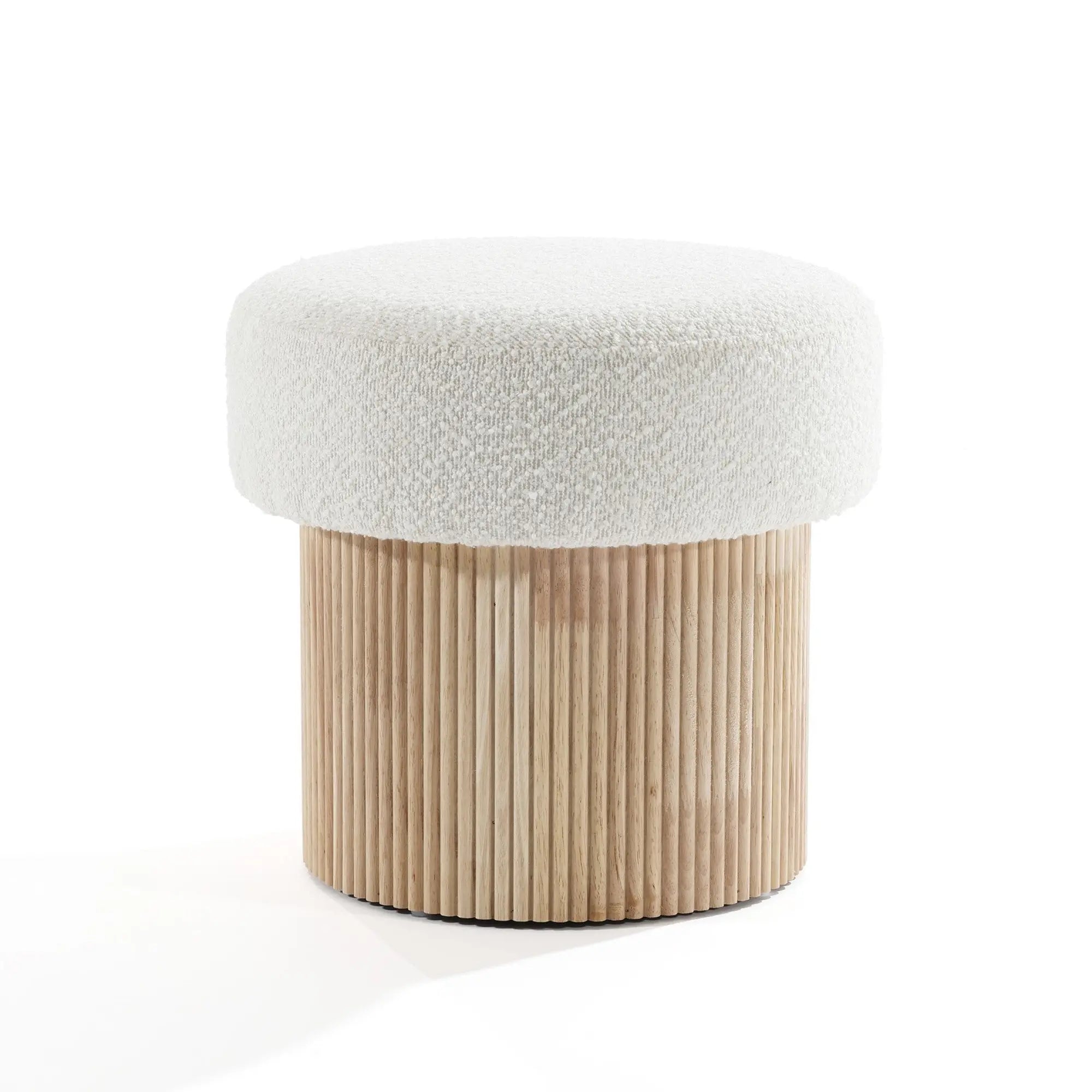 The LuxenHome Mina boucle and wood storage ottoman features a textured white cushioned seat with a cylindrical base of vertical wooden slats. Its modern, minimalist design blends neutral colors and natural materials, adding elegance to any space.