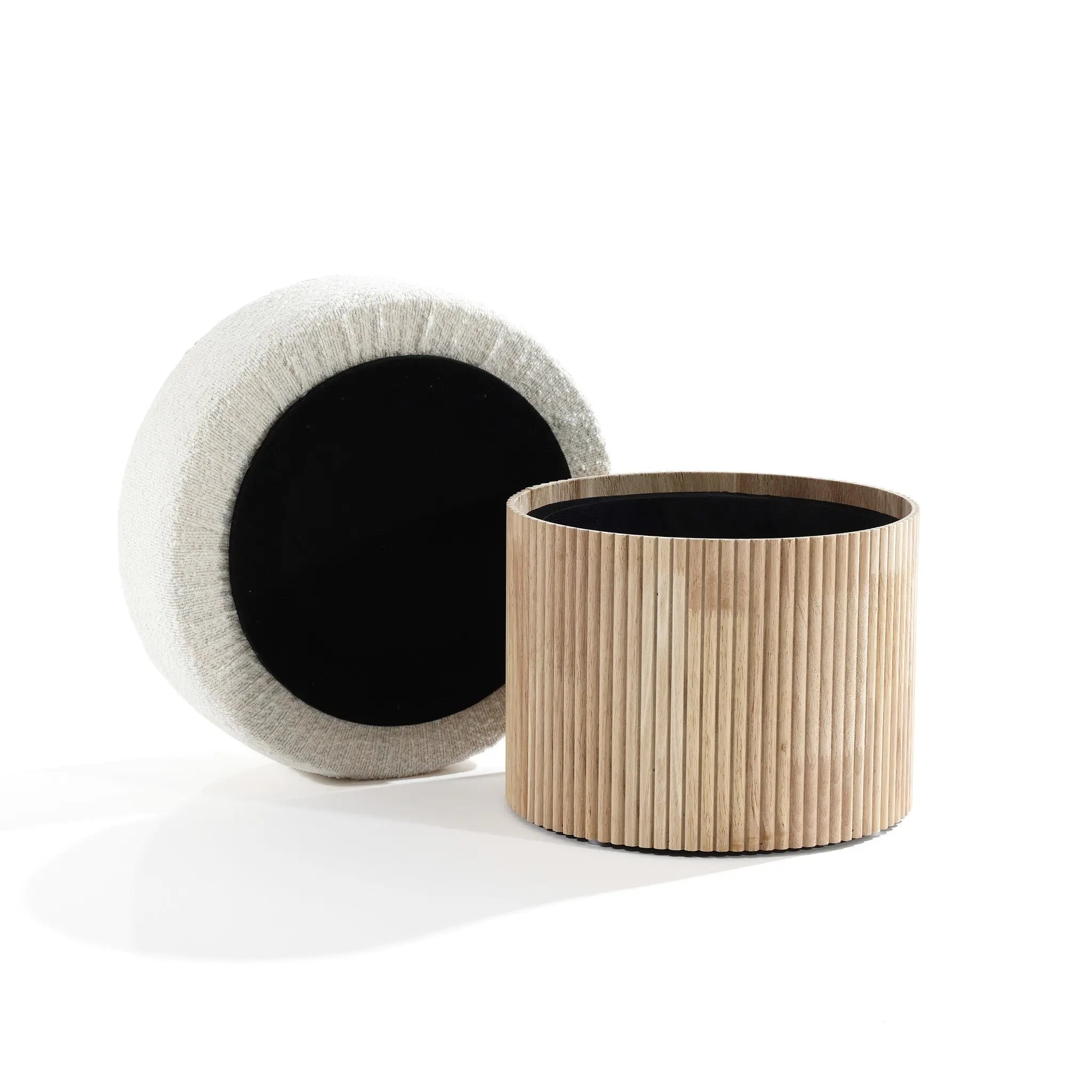 The LuxenHome Mina boucle and wood storage ottoman features a soft, textured white cushion top and a removable wooden slat base. This elegant, modern upholstered footstool complements any living space with its chic style on a sleek white surface.