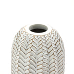 A close-up of the LuxenHome Modern Geometric Pattern Resin Tall Vase, 17 h, reveals its hand-painted textured design in white and beige tones with an antique effect. The vase has a round top opening against a plain white background.