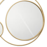 Two circular wall mirrors with thin golden frames elegantly intersect on a white background, embodying modern elegance.