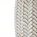 Close-up of the LuxenHome Modern geometric pattern resin tall vase, 13.5 h, featuring intricate geometric leaf designs in textured vertical rows with white leaves outlined in a dark, earthy tone for an organic appearance.