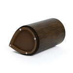 This teardrop-shaped wooden drum exudes rustic charm, with its dark brown body resting elegantly on the side. A visible circular drumhead and padded bottom add to its functional appeal, reminiscent of vintage teardrop accent tables.