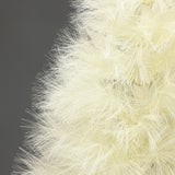 Close-up of ivory pampas grass tree, its long, thin, fluffy branches against plain gray background.