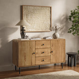Wood buffet cabinet with three drawers and two cabinets, stands beneath a textured framed artwork.