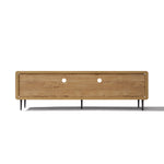 Low wood TV stand with a natural finish, black metal legs, two circular cable management holes on the back panel.