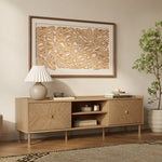 Modern wooden sideboard perfect as living room furniture, sits below abstract wall art.
