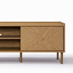 Stylish TV stand featuring open shelving on the left and a geometric-patterned closed cabinet on the right.