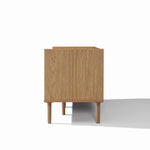 Side view of a wooden cabinet with legs, perfect as living room furniture or a TV stand with storage.