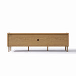 Rectangular wooden TV stand with slender legs, a central circular hole for cables, and a minimalist design.