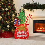 Holiday decor with Lights shaped like santa’s pack , featuring "Merry Christmas", presents, candy canes, sits by decor tree, fireplace.