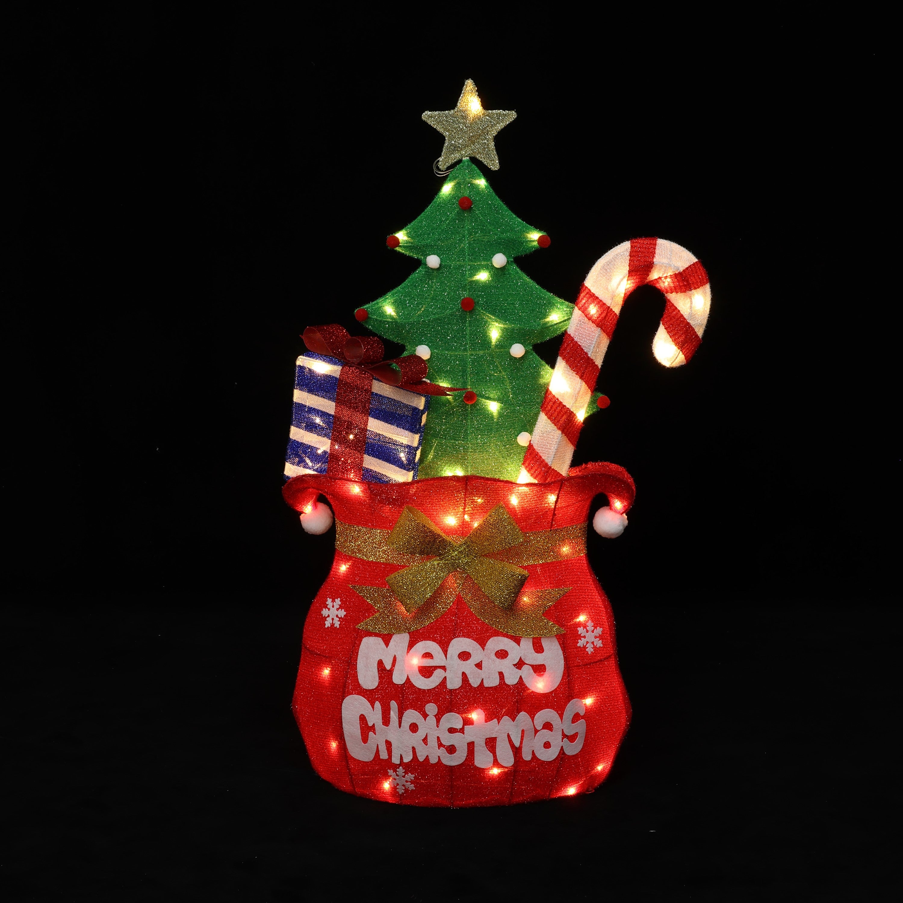 Holiday decor with Lights featuring Santa’s Pack red bag with Merry Christmas, green tree, candy cane, gift, all illuminated.