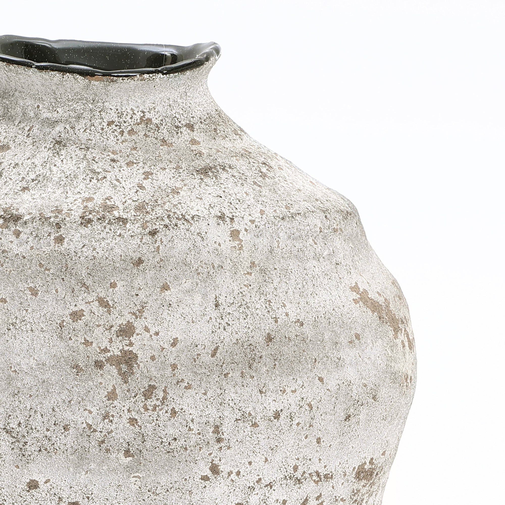 Close-up of a cement vase with a narrow black-rimmed opening, perfect for modern home décor.