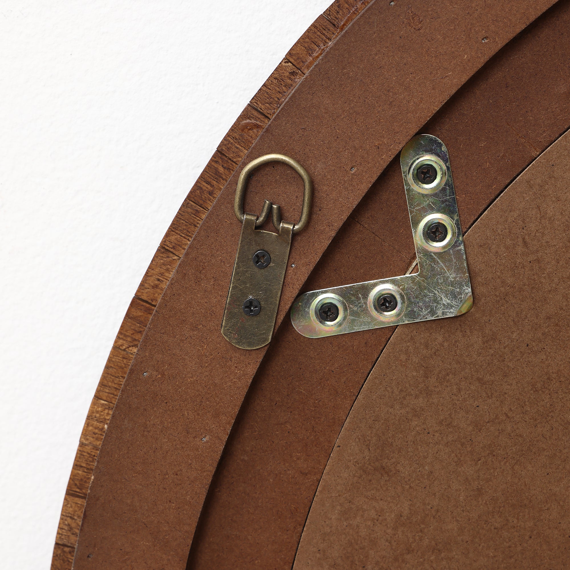 Close-up of the back, showing metal hanging hardware and brackets attached with screws.