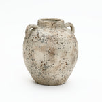 The flat base of a weathered Terracotta Vase with speckled gray and brown finish, shown on a plain white background for rustic home décor.