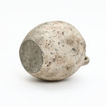 The flat base of a weathered Terracotta Vase with speckled gray and brown finish, shown on a plain white background for rustic home décor.