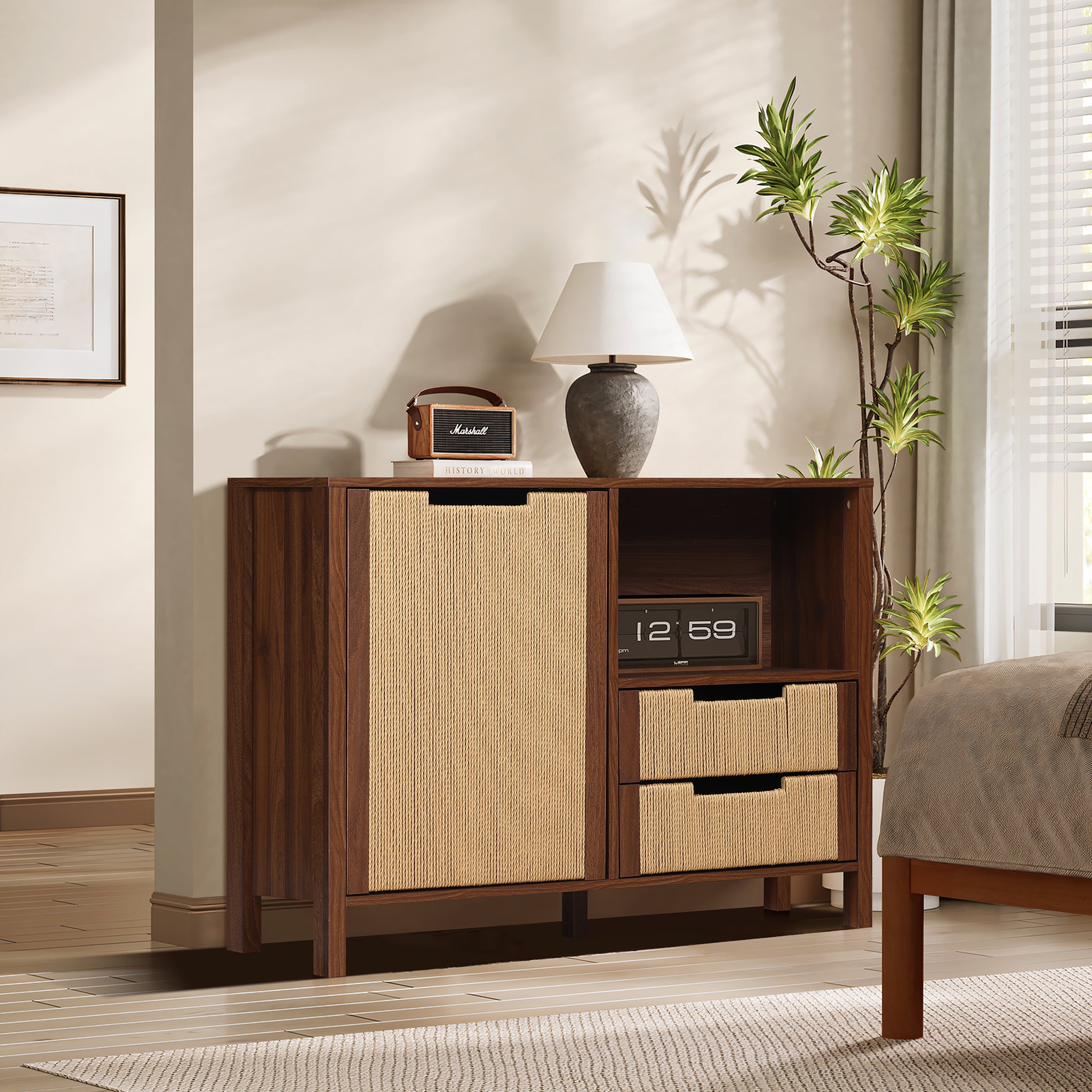 A mid-century modern storage cabinet with woven drawers, topped with a lamp, radio, and decor.