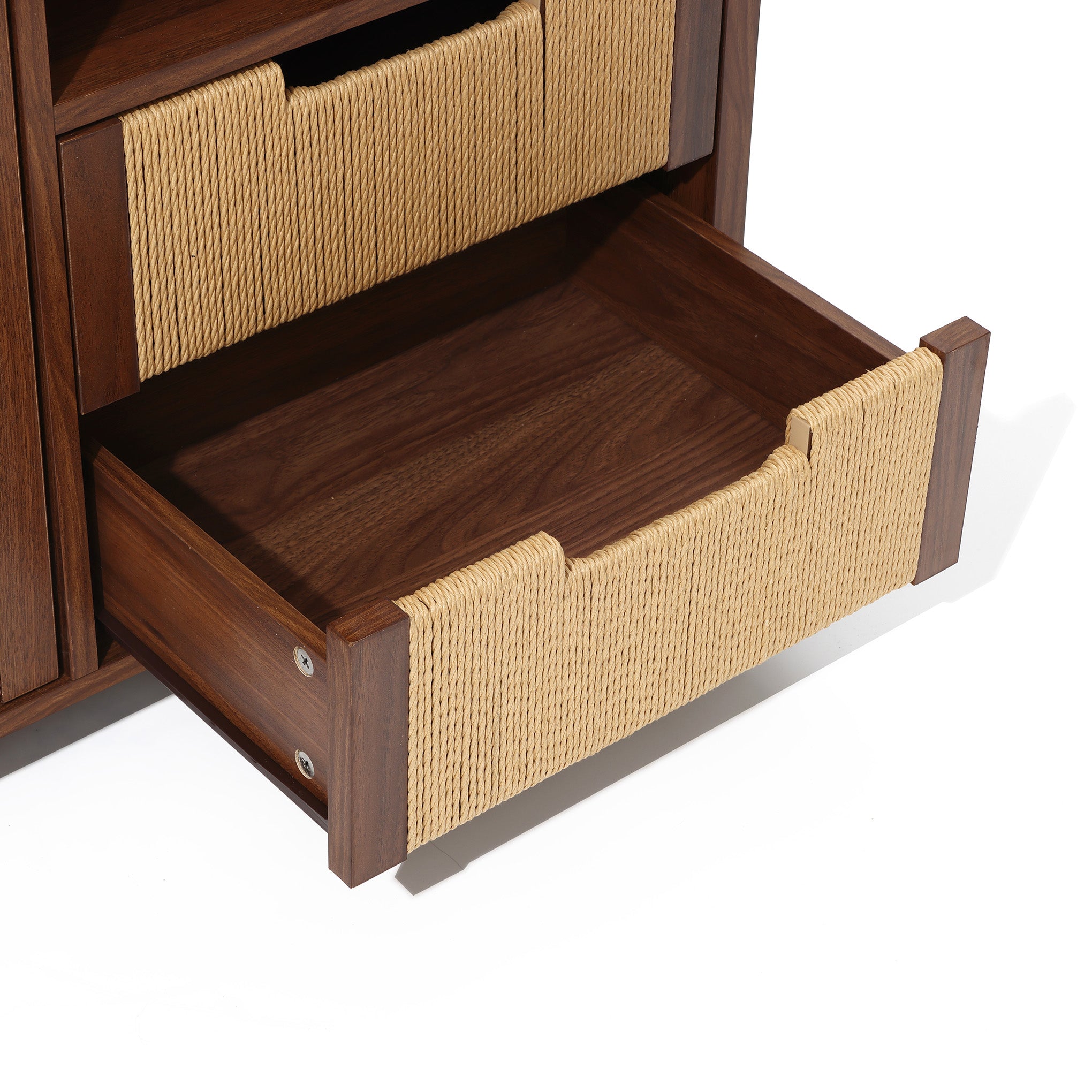 A wood storage cabinet with rope-wrapped handles is partially open, revealing the inside of the drawer and adjacent furniture structure.