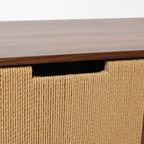 Walnut wood cabinet with a wood top ,woven rope front featuring a rectangular hand pull opening.