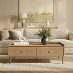 Modern living room with a beige sofa, Japandi coffee table with storage, green plant in a vase, stacked books.