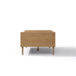 A Japandi coffee table with four short legs, crafted from wood and viewed from the front against a white background.