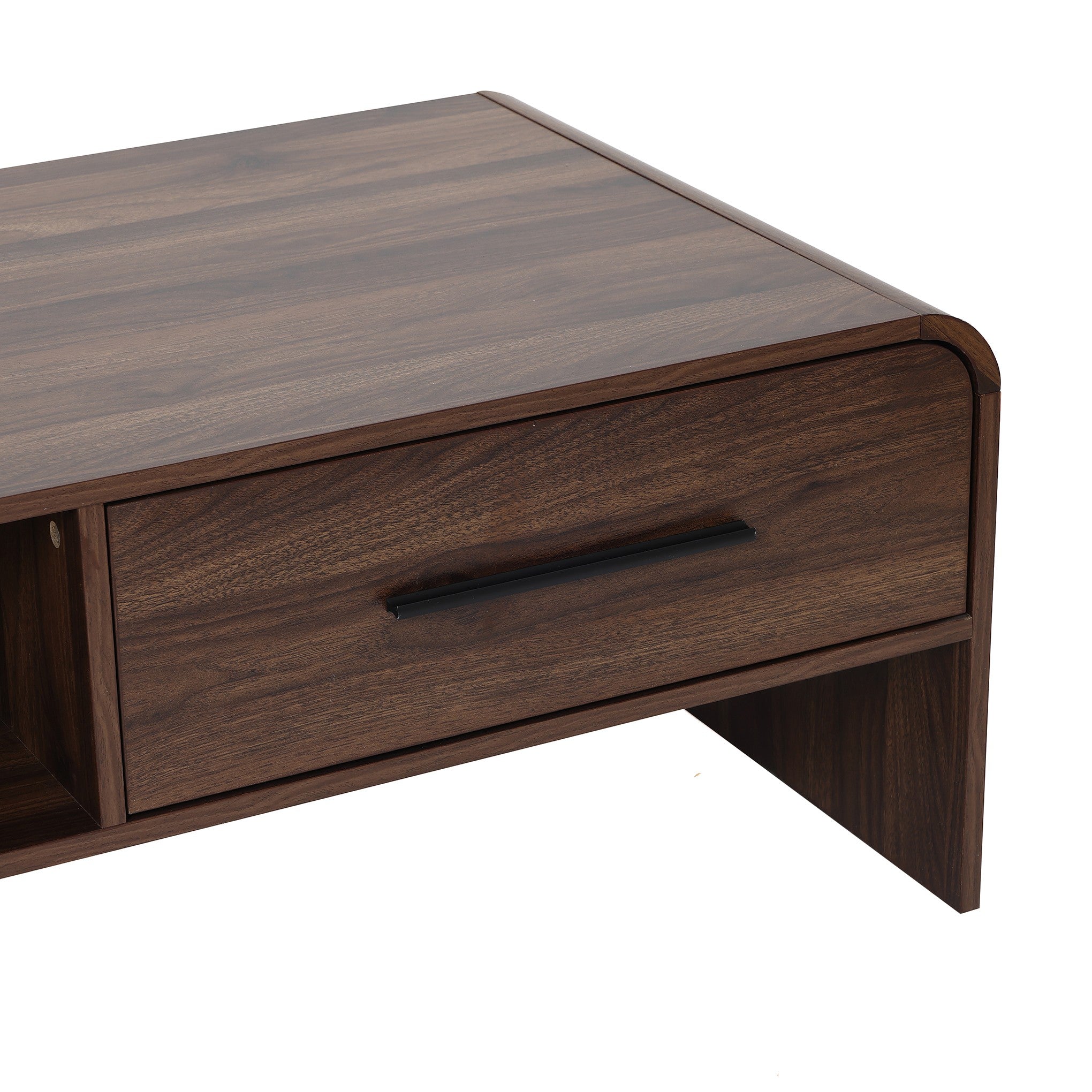 Close-up of a wooden coffee table with a dark finish, featuring a black handle on the drawer.