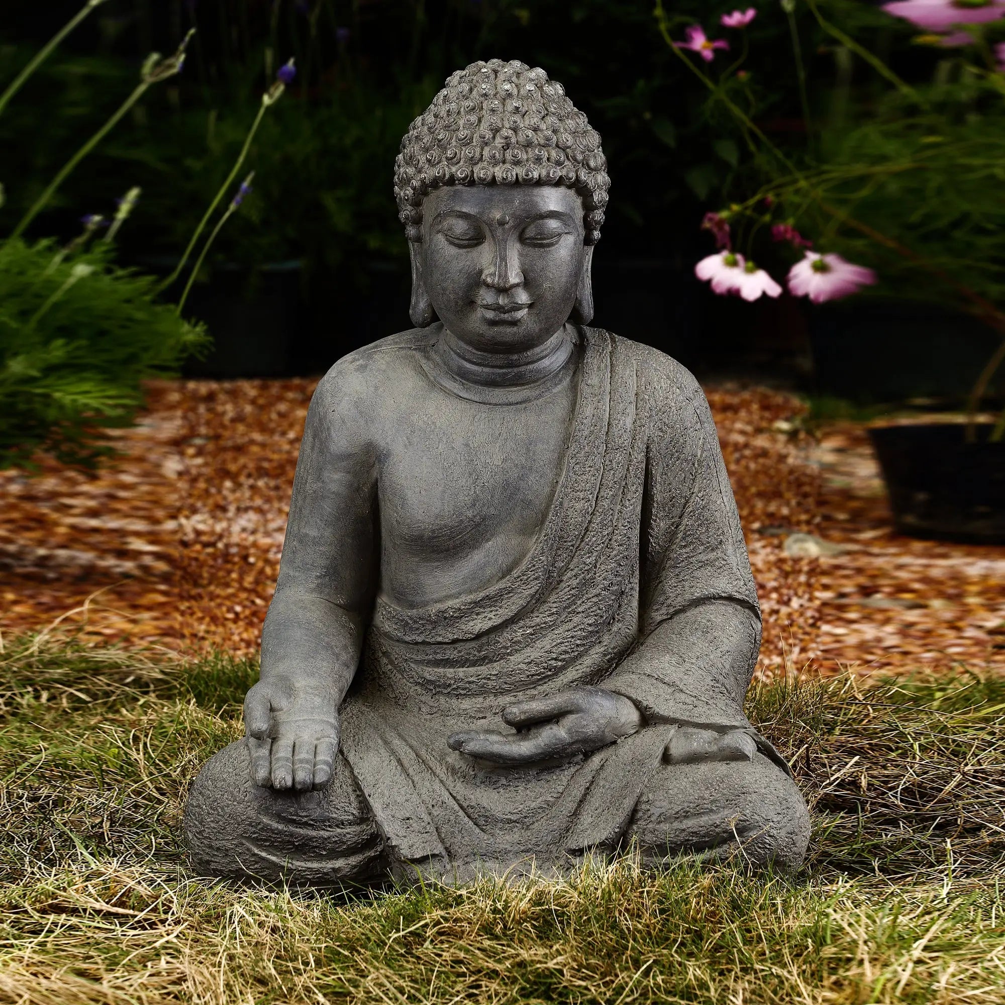 buddha-statue-sitting-in-the-grass