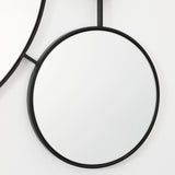 black-circular-mirror-and-black-rope-on-a-white-background