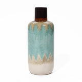 Ceramic vase with a glossy finish, featuring a zigzag pattern in blue, cream, and brown. This coastal-inspired vase adds nautical charm to any tabletop decor.