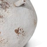 Close-up of a LuxenHome Antique cauldron planter with weathered and rusted metal. The image highlights a curved area with vintage rustic charm, showing patches of rust and peeling paint on a greyish-white background.