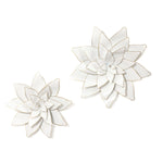 Two white metallic art sculptures, shaped like stylized lotus flowers with layered petals and gold edges, bring a touch of flower power to any room against a pristine background.