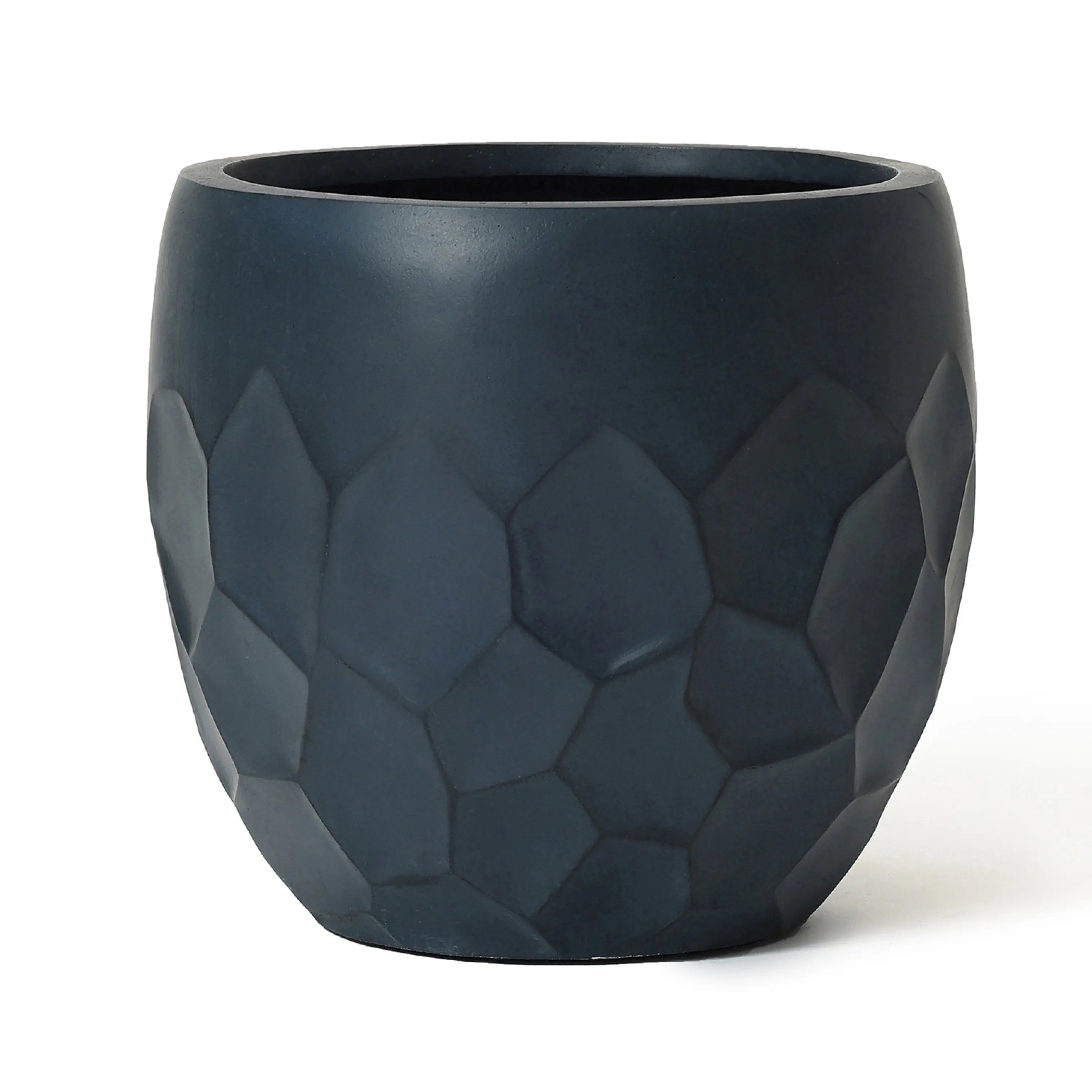 Dark gray stone planter crafted from magnesium oxide material, featuring a striking geometric pattern around its middle section. Perfect for both indoor and outdoor use.