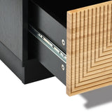 Close-up of the Ethan bamboo stripped black nightstand by LuxenHome with a partially open drawer showcasing a wooden front panel with a geometric pattern. The visible metal sliding mechanism highlights its modern and minimalist style.
