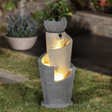 A flower pot water fountain with LED lights, featuring three concrete-like basins and a small potted plant on top, adds charm to garden spaces when placed on a grassy lawn.