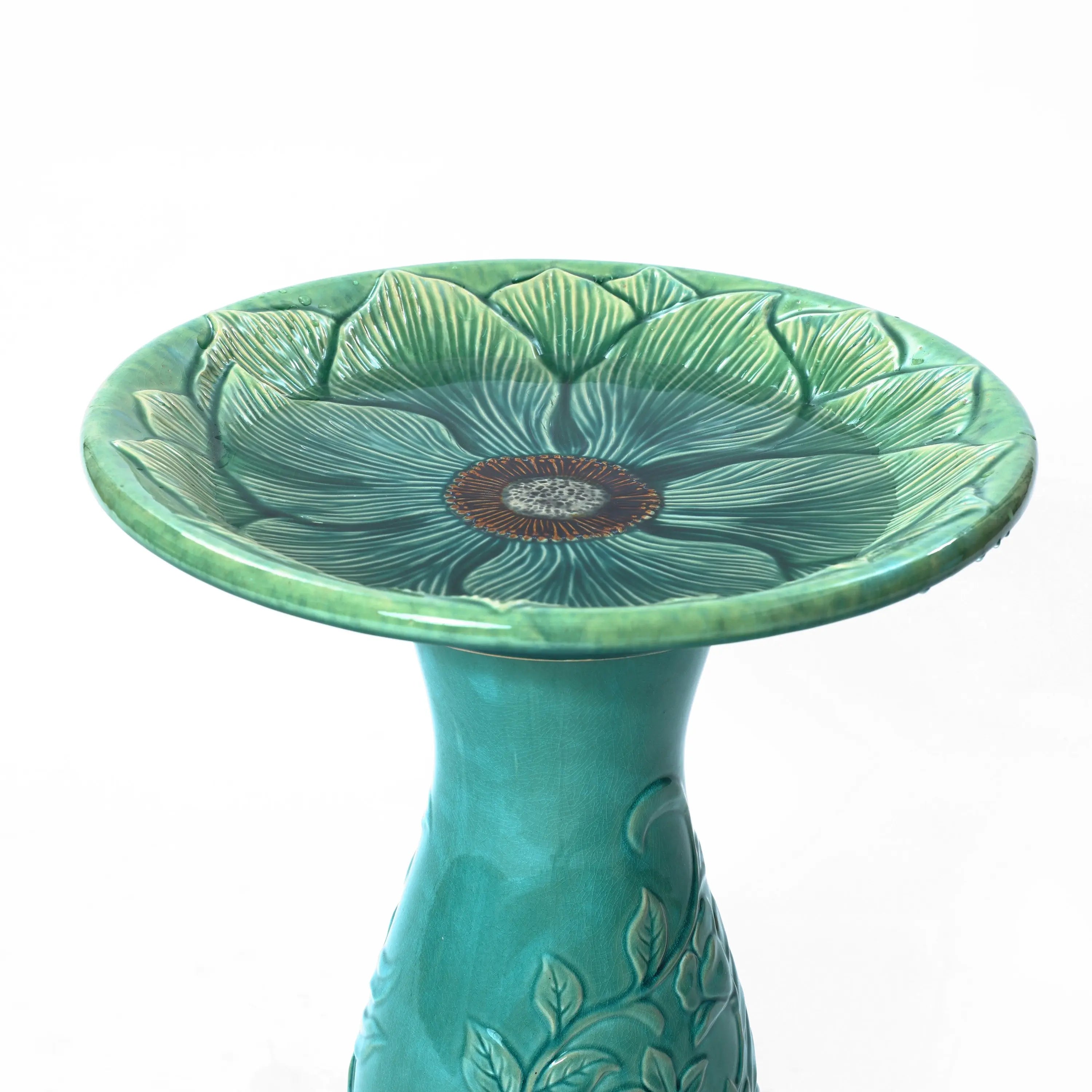 dish top of a ceramic bird bath