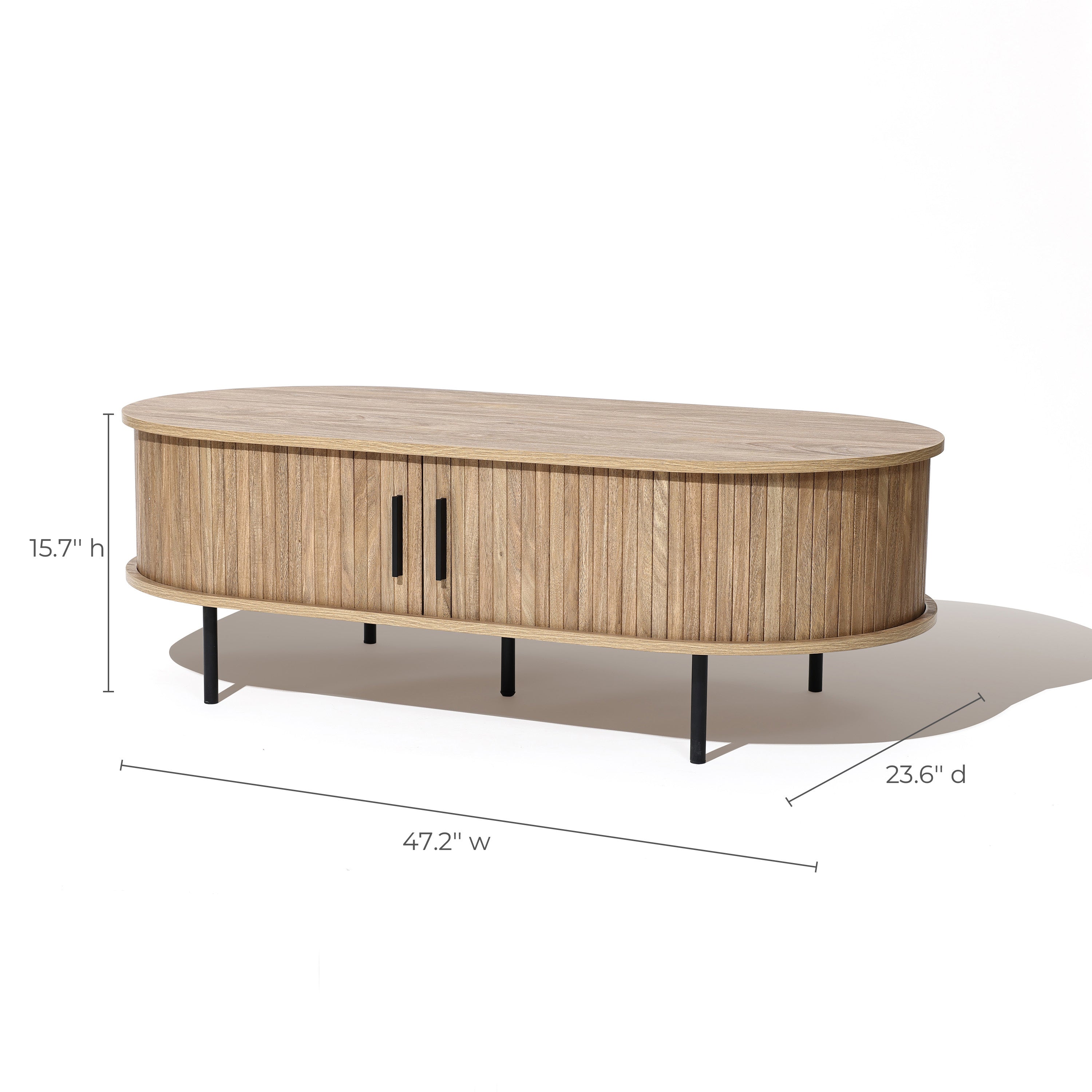 The LuxenHome Aria tambour door coffee table is an oval-shaped piece with vertical slats and a captivating oak grain finish, featuring two central handles. Measuring 47.2 W x 23.6 D x 15.7 H, it stands on four black metal legs, blending function and form stylishly.