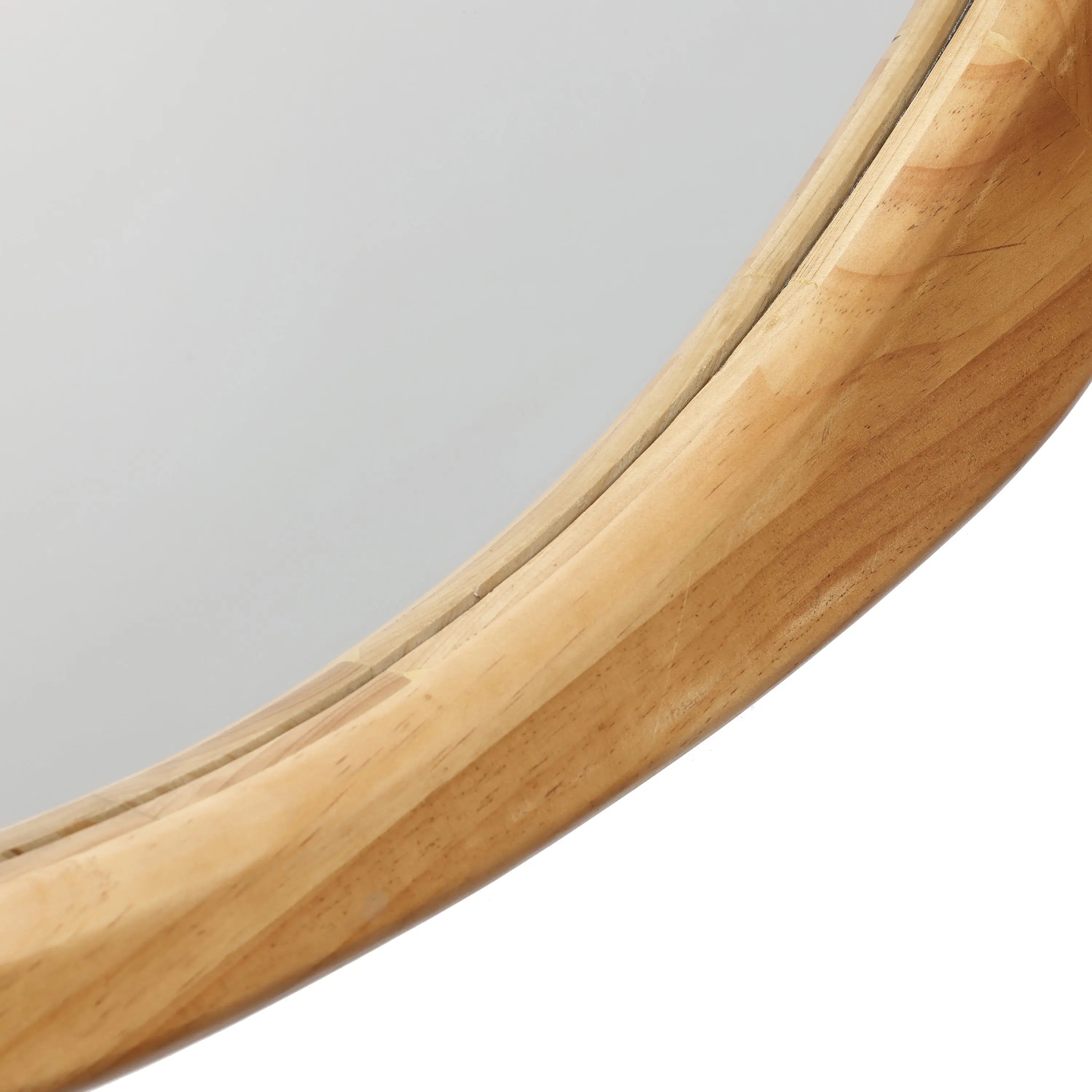 Close-up of a mirror with a light wooden frame, showcasing the smooth texture and rounded edge. This piece adds a touch of natural decor, seamlessly blending into any space with its organic charm.