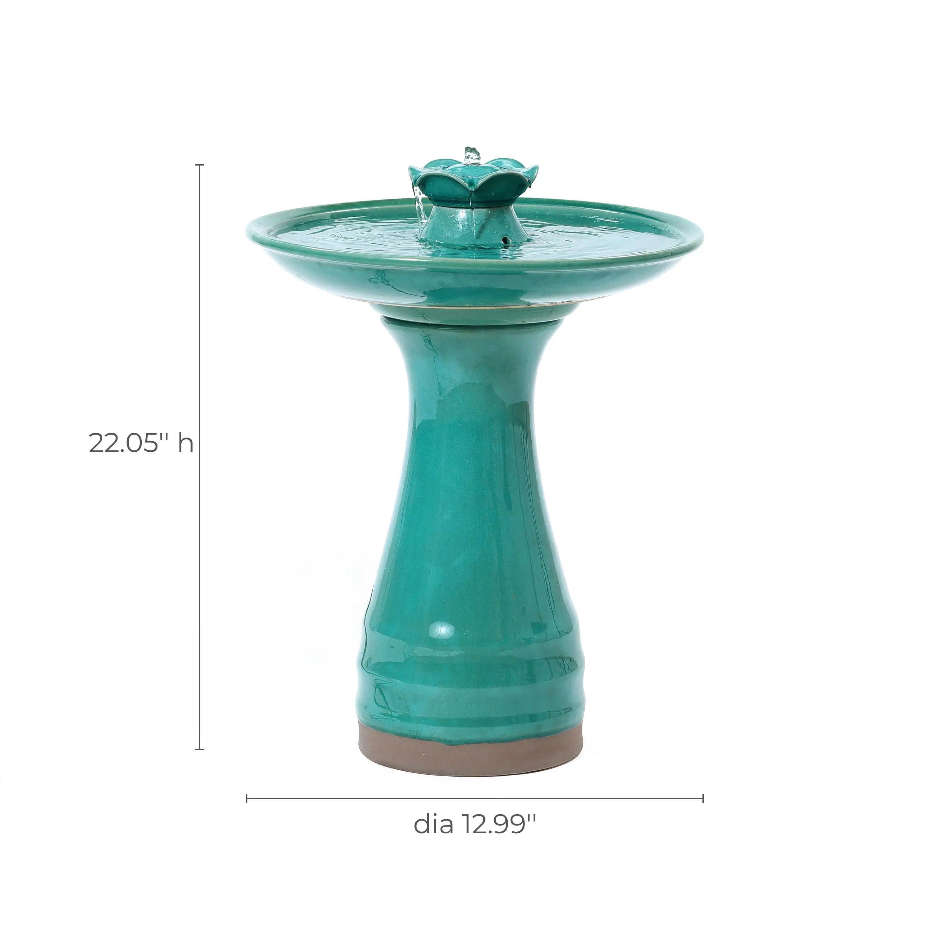 Green ceramic bird bath with a pedestal base and an elegant lotus design, measuring 22.05 inches in height and 12.99 inches in diameter—a striking decorative garden piece that enhances any outdoor space.