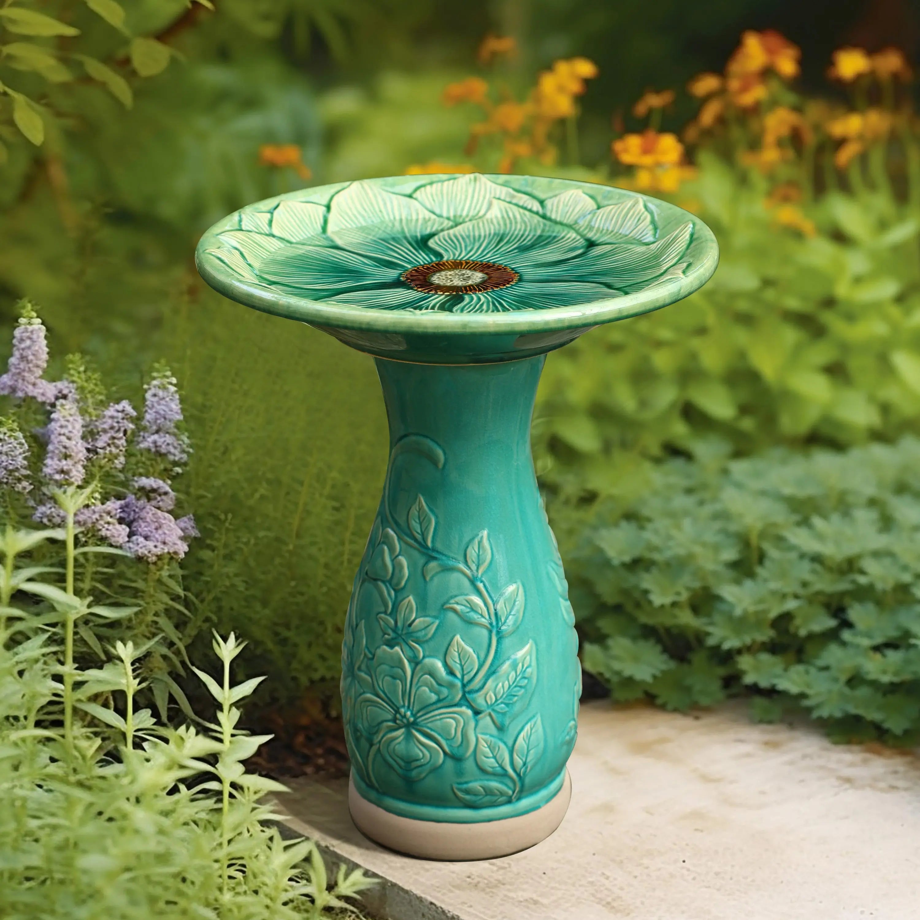 ceramic bird bath in greenery garden