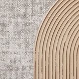 Close-up of a textured surface with a burlap pattern on the left and an arc of parallel wooden grooves on the right, creating a mesmerizing piece of abstract wall art.