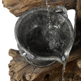 water-dripping-into-bucket-of-a-water-fountain