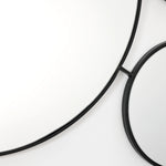 black-circular-mirror-and-a-white-circular-mirror-frame