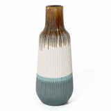 High-quality ceramic vase with vertical ridges, showcasing a colorful blend of brown, white, and blue sections. Its narrow opening adds an elegant touch to any home decor.