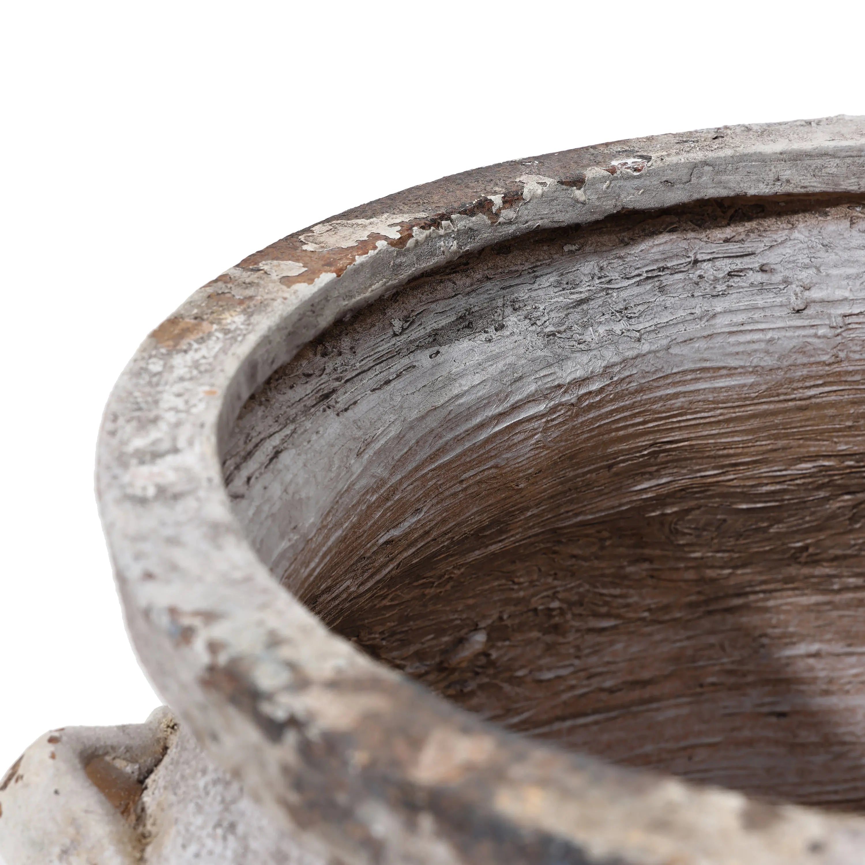 A close-up of the LuxenHome Antique cauldron planter shows its weathered, cracked surface resembling a vintage rustic-look ceramic pot. The uneven rim with gray and brown shades suggests age and use.