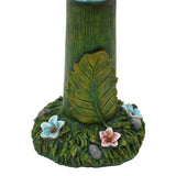 tree-trunk-with-a-base-covered-in-green-moss-and-flowers