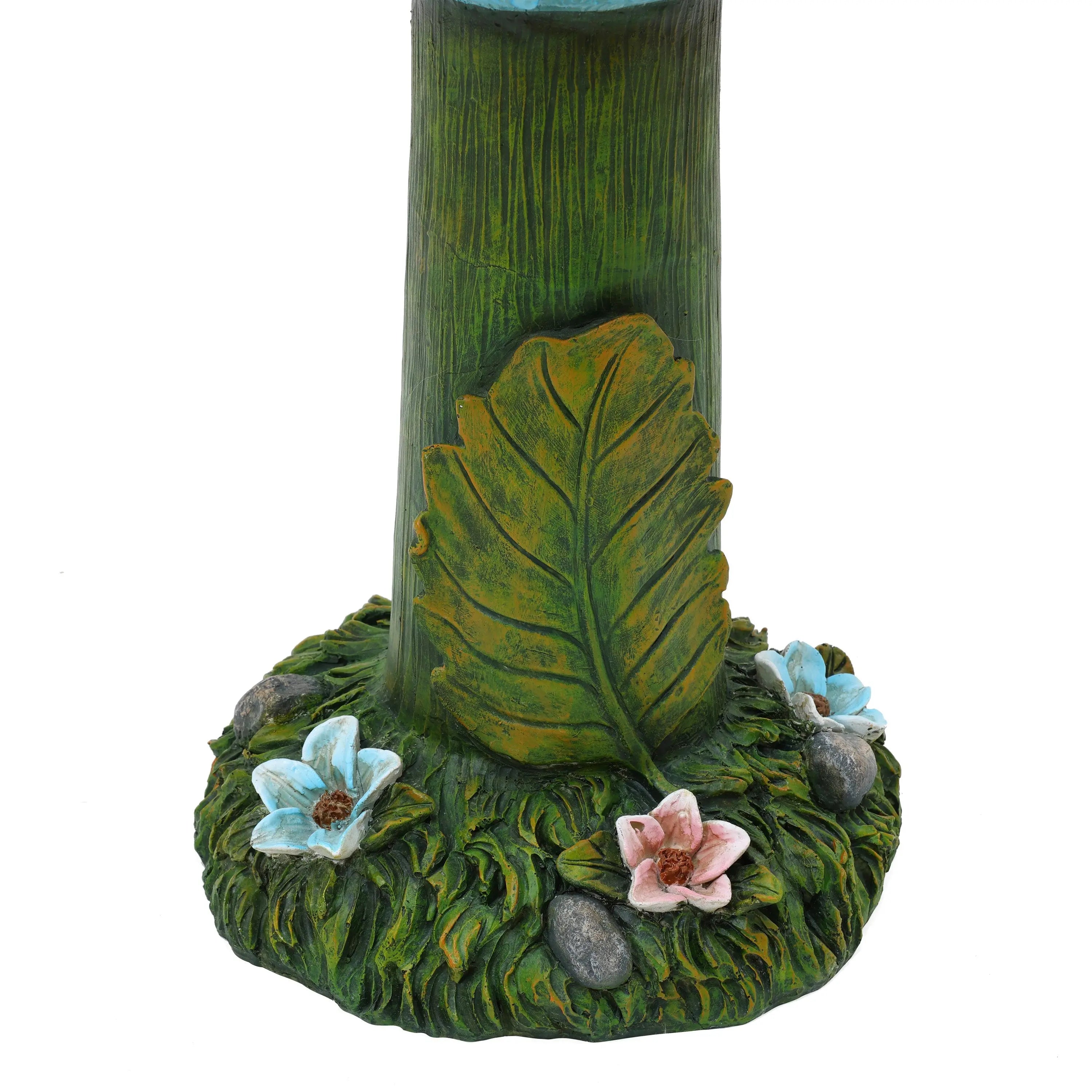 tree-trunk-with-a-base-covered-in-green-moss-and-flowers