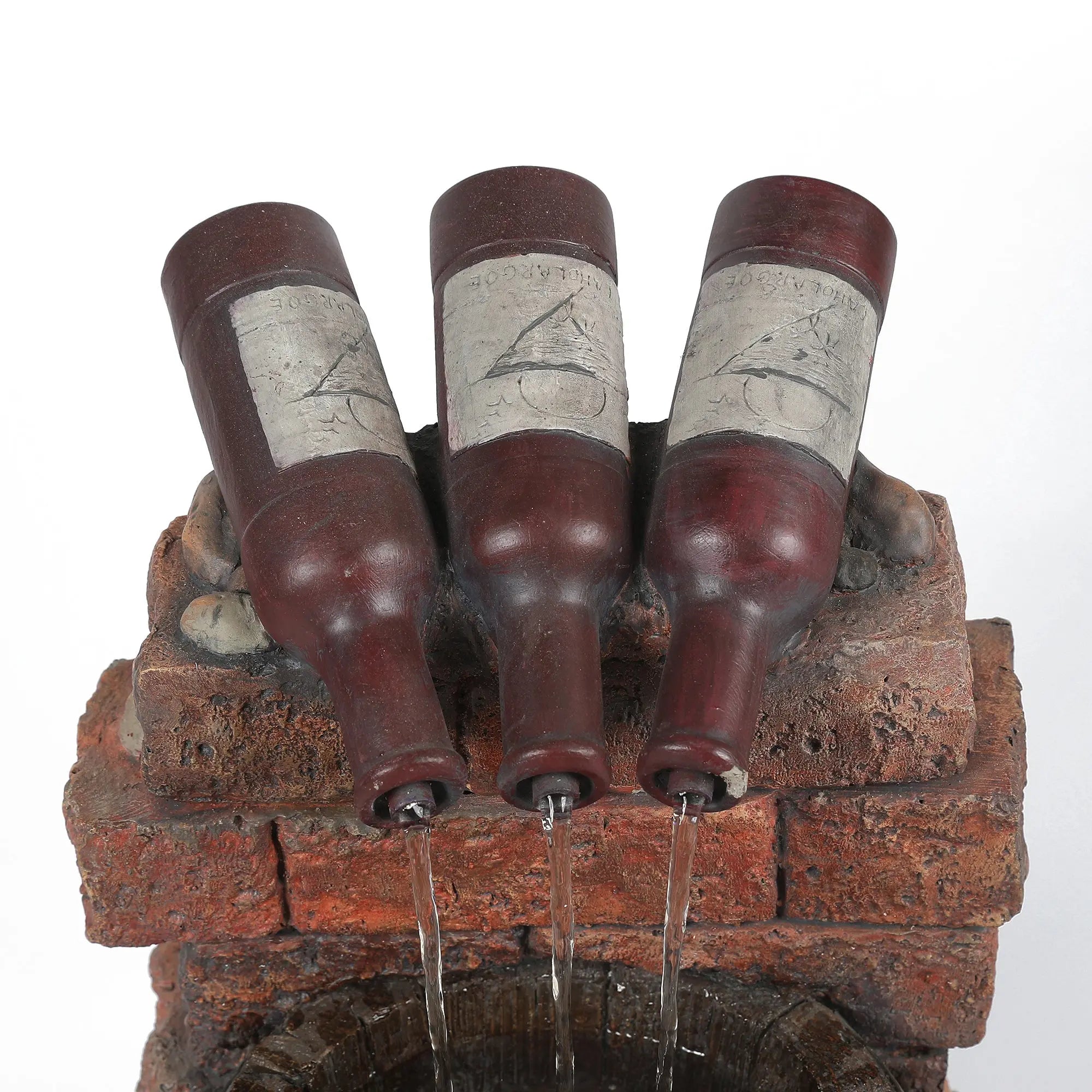 Three brown glass bottles are positioned upside down on a brick structure, with soothing water sounds flowing from their openings into a container below.