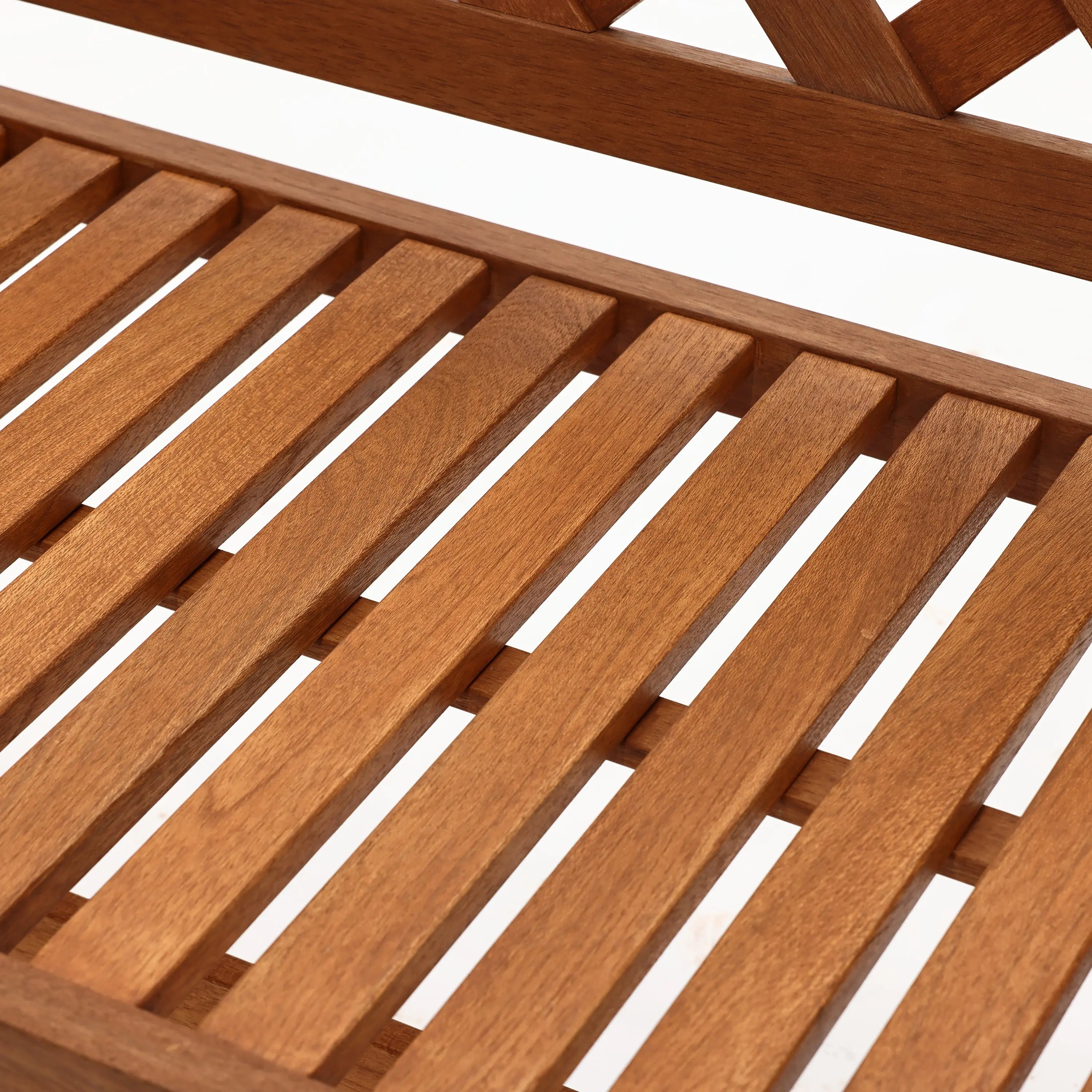 Close-up of an outdoor bench seat featuring evenly spaced slats in solid wood construction.