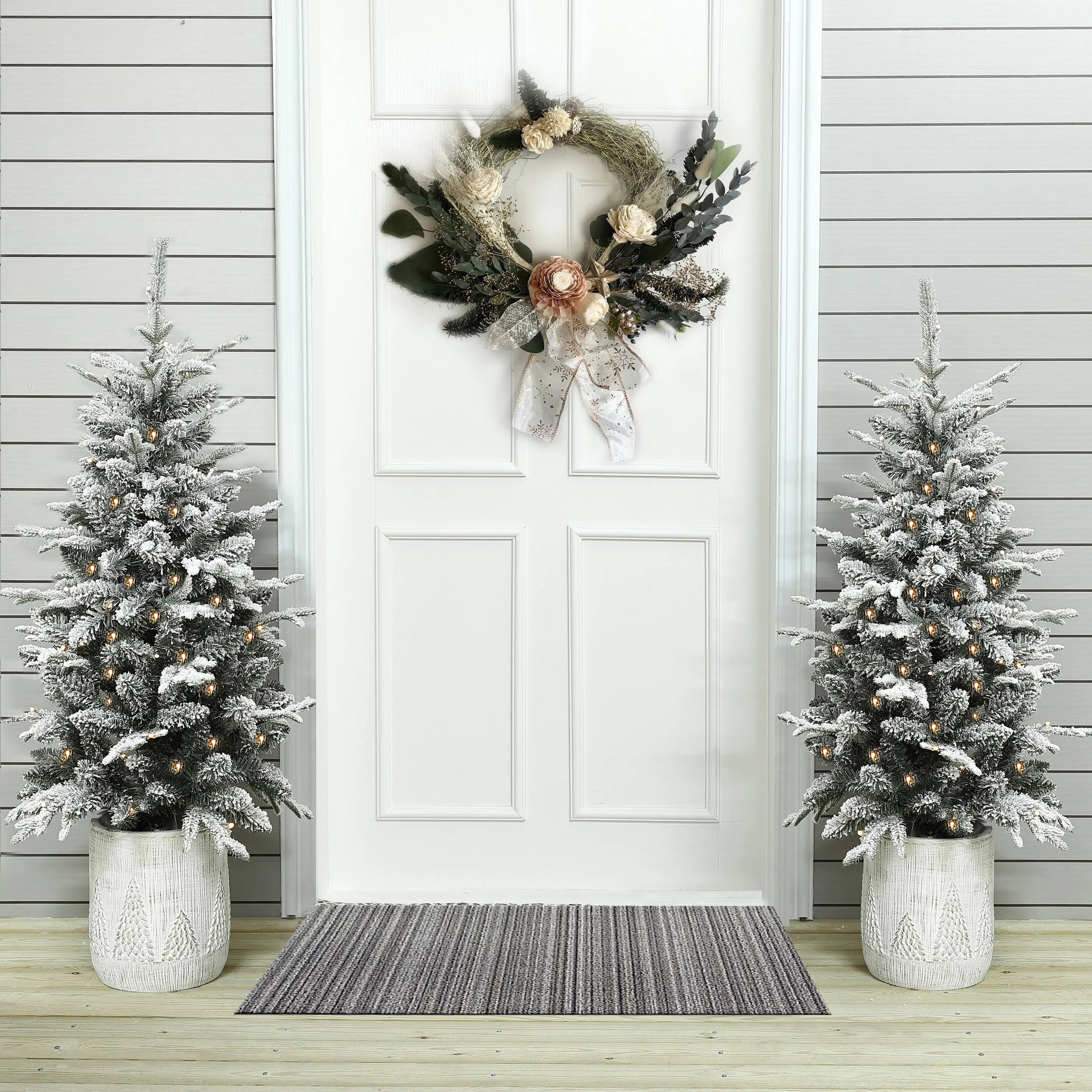 using-2-artificial-christmas-trees-in-front-of-the-porch-that-make-more-ambiancer-of-christmas-day
