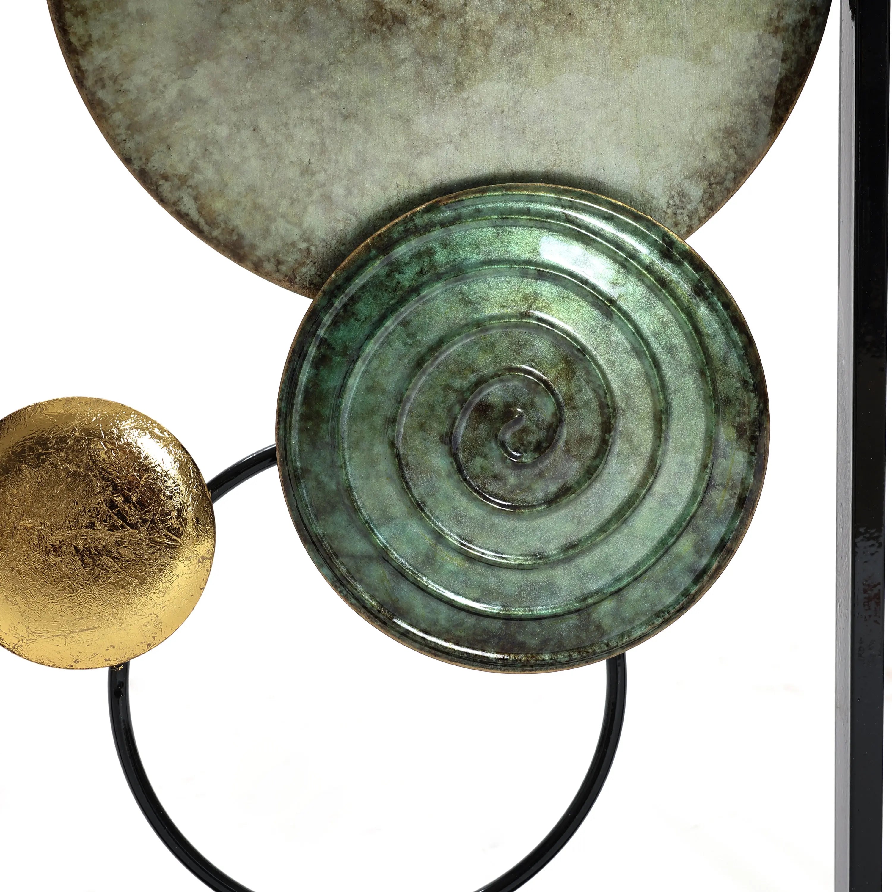 Abstract metal wall decor with circular shapes featuring gold, green spirals, and metallic textures, perfect for a modern setting.