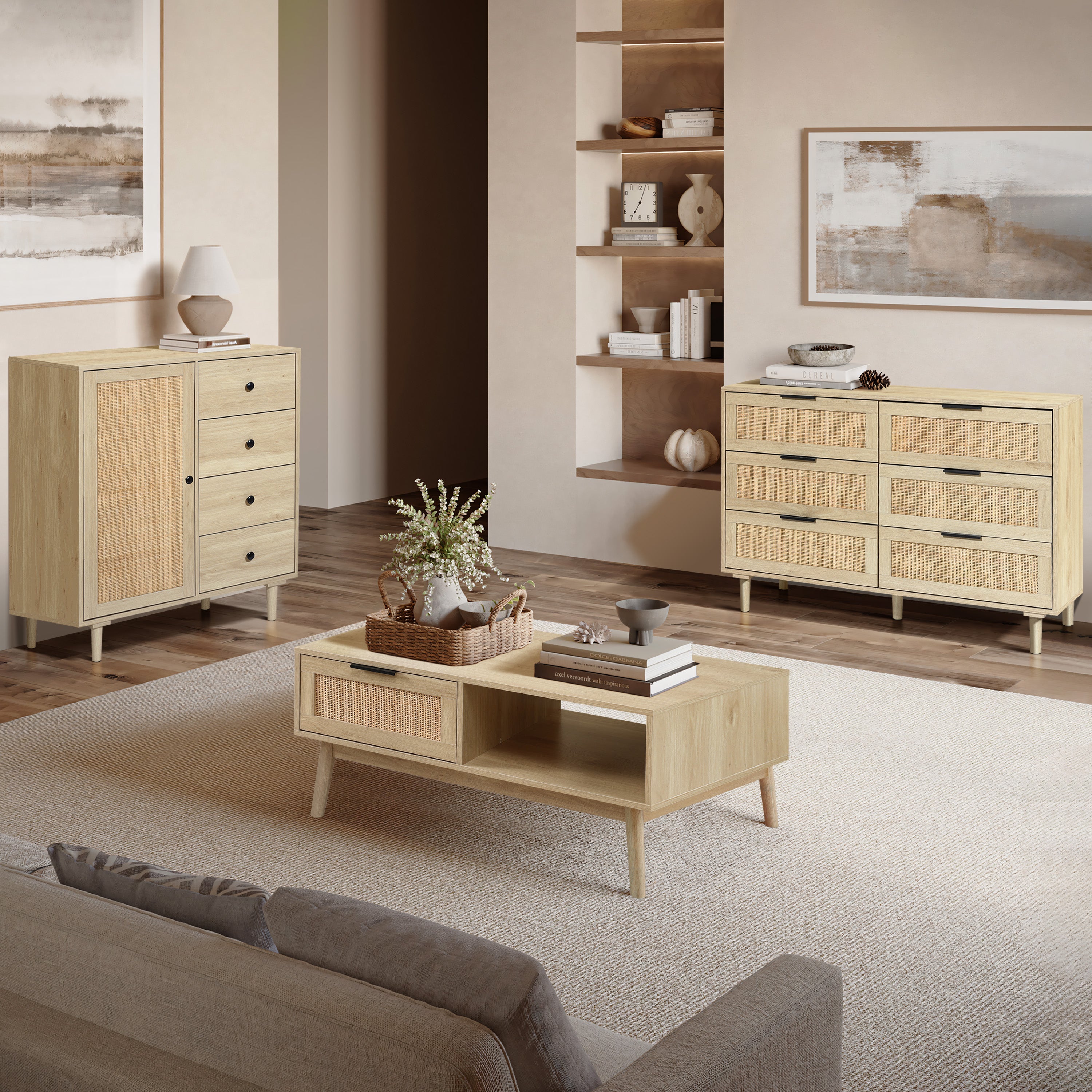 A set of six light wood furniture pieces, including dressers, cabinets, and a coffee table, displayed in a bright room with a view of the ocean through a large window.